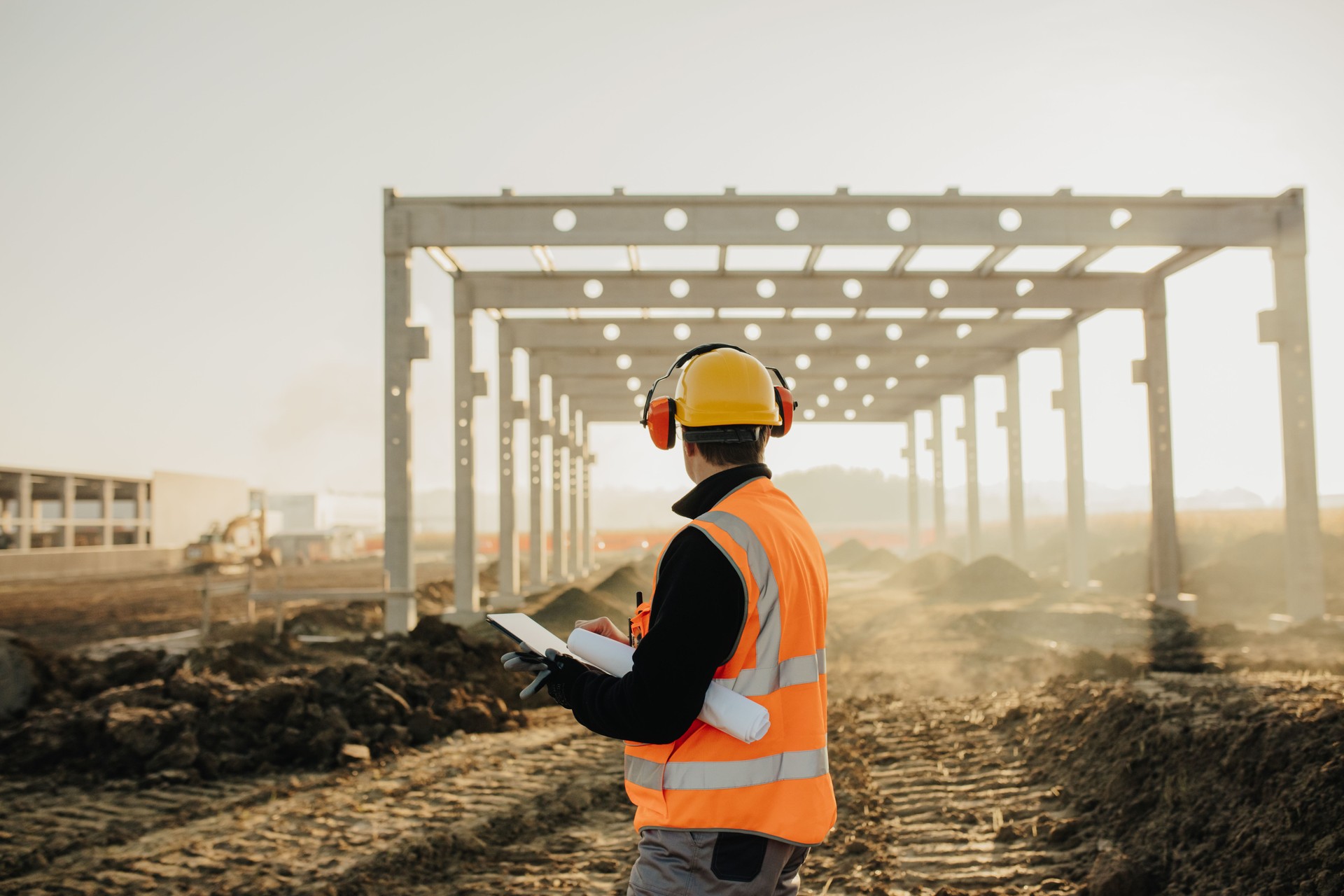 Architect using digital tablet at construction site